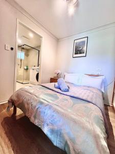 a bedroom with a large bed and a mirror at Salisbury Suburban Escape in Brisbane