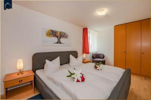 Postel nebo postele na pokoji v ubytování Waldsiedlung Waldhaus App 4.1