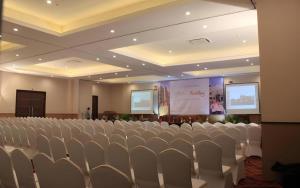 a conference room with chairs and a projection screen at Horison Hotel Sukabumi in Sukabumi +111 photos