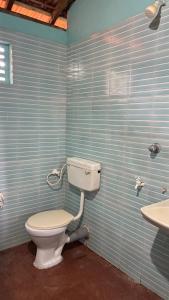 a bathroom with a toilet and a sink at Dream way homestay in Gokarna