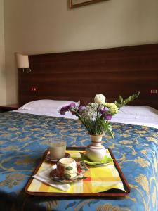 Postel nebo postele na pokoji v ubytování Hotel Altavilla Dieci