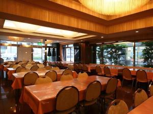 a row of tables and chairs in a restaurant at Ikebukuro Royal Hotel in Tokyo