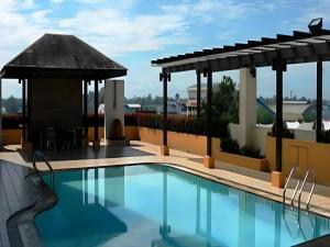 a pool at a hotel with a gazebo at Tanahmas The Sibu Hotel in Sibu