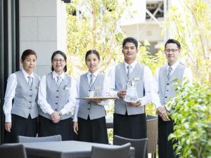 a group of people posing for a picture at Goto Tsubaki Hotel in Hukue