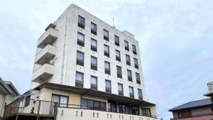 a tall white building with windows on top of it at Inuyamakan in Inuyama +27 photos