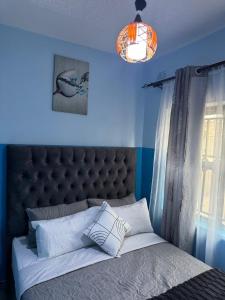 Ένα ή περισσότερα κρεβάτια σε δωμάτιο στο Twin Pines Masvingo