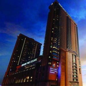 a tall building with a sign on the side of it at Ridge Service Suites in Kuala Lumpur