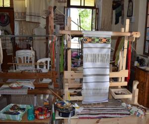 a room filled with lots of furniture and a table at Lasa Heights Hotel in Lasa
