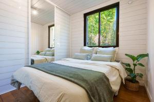 a bedroom with a large bed and a window at Appartment - Panoramic Sea View - Swimming Pool in Villefranche-sur-Mer +41 photos