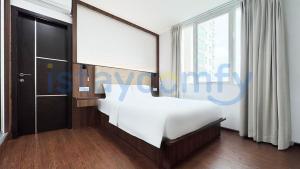 a bedroom with a white bed and a large window at 3BR The BCC Residence 1012 City View in Nagoya +16 photos