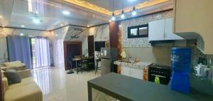 a kitchen with a counter top in a room at Vel Serene Villa in Panglao Island