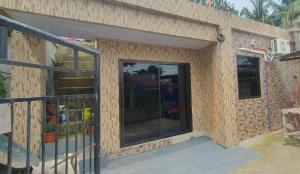 a house under construction with a glass door at Vel Serene Villa in Panglao Island