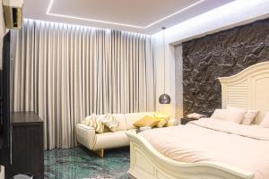 Ένα ή περισσότερα κρεβάτια σε δωμάτιο στο احسان للشقق المفروشة