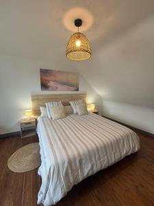 Postel nebo postele na pokoji v ubytování L'abri du marin