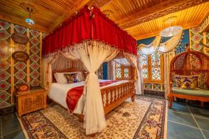 a bedroom with a bed with a canopy at Wusong Guyi Western Regions Designer Courtyard in Yining
