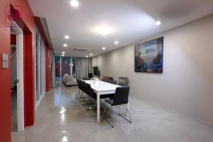 a dining room with a white table and chairs at Villa Magenta Hua Hin in Hua Hin +51 photos