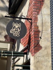 a sign on the side of a brick building at Kulton Apartment in Kanazawa