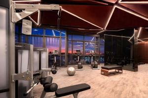 a room with a gym with a lot of equipment at Edge central Pattaya by kansiree in Pattaya