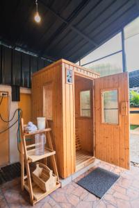 a wooden out house with a ladder and a table at Poolnest Villa Aonang Tranquil Private Retreat in Krabi town