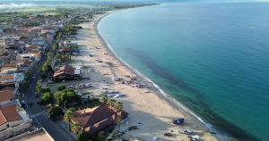 an aerial view of a beach with people and the ocean at Case Vacanze Angolo Sul Mare in Nicotera Marina