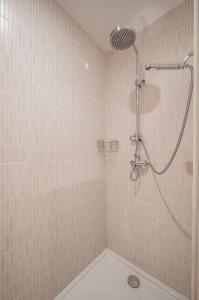 a shower in a tiled bathroom with a shower at Le COQ Jean Jaurès - Garage XL-AC- Monaco Border in Roquebrune-Cap-Martin +14 photos