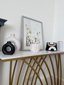a shelf with a picture and some objects on it at Cozy plaza lodge in Rochester