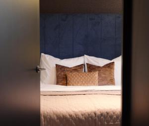 Ένα ή περισσότερα κρεβάτια σε δωμάτιο στο De Nassau - In de winkelstraat