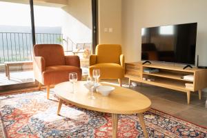 TV a/nebo společenská místnost v ubytování Le 234, entre lac et montagnes