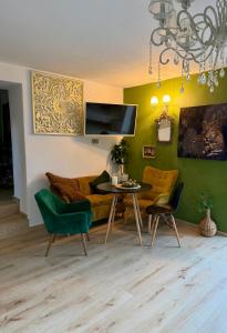 a living room with a couch and a table and chairs at Katerina's House in Volimes