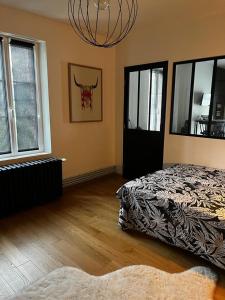 Ένα ή περισσότερα κρεβάτια σε δωμάτιο στο Studio 2 personnes au coeur du Berry