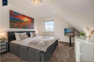 Ένα ή περισσότερα κρεβάτια σε δωμάτιο στο Landhaus am Krebssee