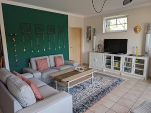 Μια τηλεόραση ή/και κέντρο ψυχαγωγίας στο Ferienwohnung Am Schlössle