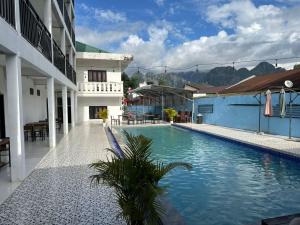 a swimming pool in the middle of a building at Santi Villa in Vang Vieng +31 photos