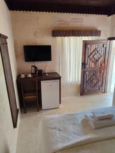 TV a/nebo společenská místnost v ubytování sumatra otel