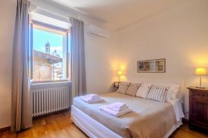 Postel nebo postele na pokoji v ubytování Attico a pochi passi dal Campo