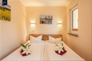 En eller flere senge i et værelse på Ferienhaus Janina Ferienhaus Janina