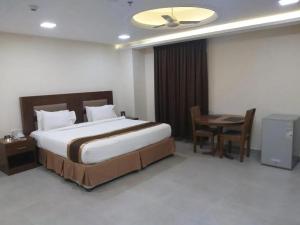 Postel nebo postele na pokoji v ubytování Bristol Hotel Salalah + 18 fotografií