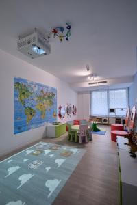 a living room with a map of the world on the wall at Hotel Le Soleil in Lido di Jesolo +80 photos
