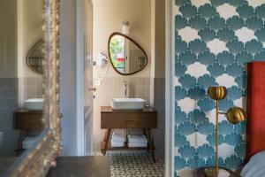 a bathroom with a sink and a mirror at Le Parc Maison d'hotes de Charme in Provins +49 photos