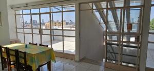 a room with a table and chairs and a window at Amarante Hotel in Juazeiro