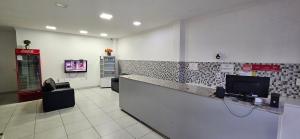 a waiting room with a cash counter in a store at Amarante Hotel in Juazeiro
