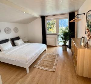 Ένα ή περισσότερα κρεβάτια σε δωμάτιο στο Appartement Mona