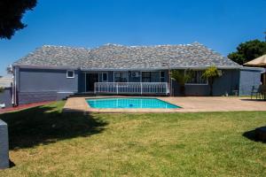 a house with a swimming pool in a yard at Sitir guest villa 20 Johan Meyer St, Linmeyer, Johannesburg in Johannesburg