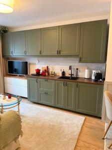 Kuchyň nebo kuchyňský kout v ubytování Cozy Place