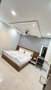 a bedroom with a bed in a room at Hotel Shri Vishwanath in Varanasi