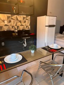 Kuchyň nebo kuchyňský kout v ubytování Pousada Flat Lourdes Residence