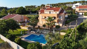 an aerial view of a house with a swimming pool at Apartment Alex in Zadar
