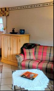 a living room with a couch and a table at Haus Wolfgang in Geldern +9 photos