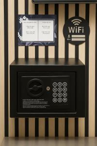 a microwave oven with a sign on top of it at Hotel Parc & Lac in Montreux