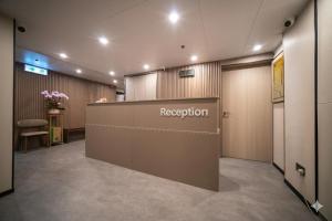 an office with a reception desk in a room at Ha Fa Villa in Hong Kong